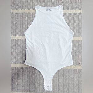 White XL bodysuit. New Never worn.